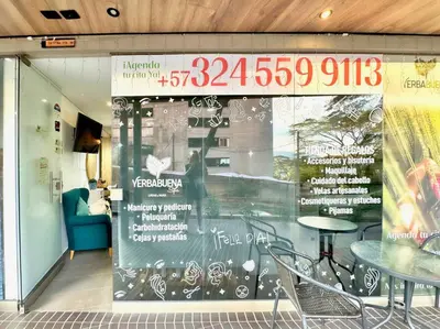 a window of a restaurant with a table and chairs at 3BR AC Top Location Views El Poblado in Medellín