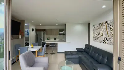 a living room with a couch and a table at 3BR AC Top Location Views El Poblado in Medellín