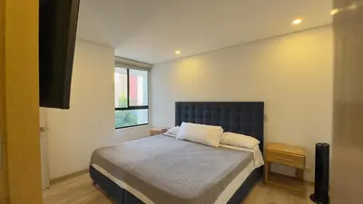 a bedroom with a bed and a window at 2BR Luxe Cozy Views Las Brujas Envigado in Envigado