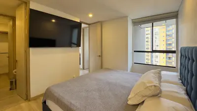 a bedroom with a bed and a large window at 2BR Luxe Cozy Views Las Brujas Envigado in Envigado