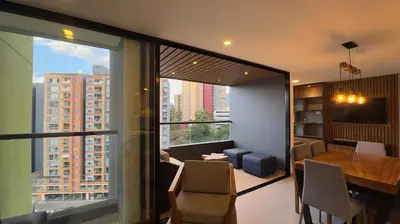 a dining room with a view of a building at 2BR Luxe Cozy Views Las Brujas Envigado in Envigado
