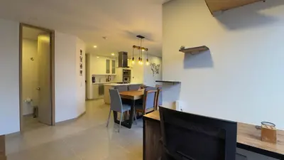 a kitchen and dining room with a table and chairs at 2BR Luxe Cozy Views Las Brujas Envigado in Envigado