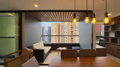 a living room with a view of a building at 2BR Luxe Cozy Views Las Brujas Envigado in Envigado