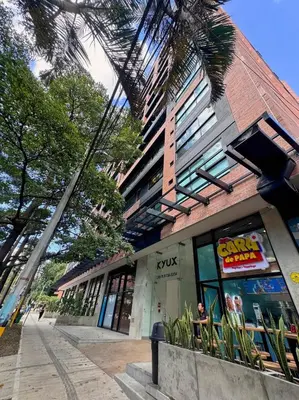 a store front of a building on a city street at 1BR AC Near Unicentro, UPB & Parques Laureles in Medellín