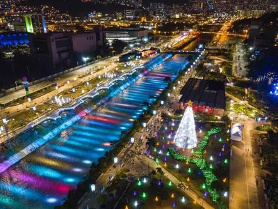 a city lit up at night with a christmas tree at Luxury 3BR Apartment in the heart of Medellin in Medellín