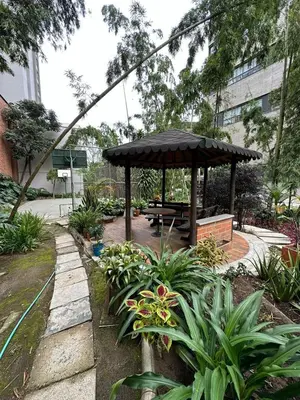 a picnic shelter with a picnic table in a garden at Apartamento en el Poblado junto al cc Santa Fe in Medellín