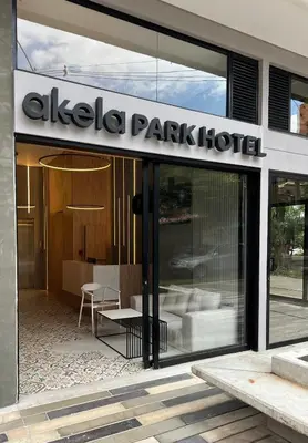 a building with a park hotel sign on the facade at Akela Park Hotel in Medellín