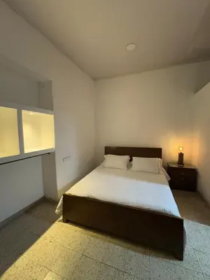 a bedroom with a large bed and a window at Vivienda turística Casa Rionegro colonial in Rionegro