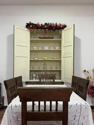 a dining room with a table and a hutch at Vivienda turística Casa Rionegro colonial in Rionegro