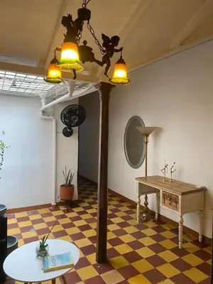 a room with a table and a mirror and lights at Casa Oasis - La Estrella in La Estrella