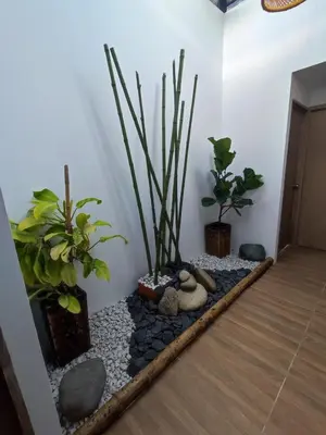 a room with some plants and rocks on a floor at habitación campestre para pareja LAVANDA in Jardin