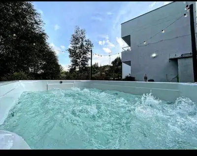 a large pool of water in the backyard of a house at Villa cerca al aeropuerto in Guarne