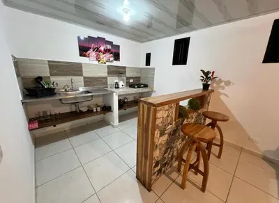 a kitchen with a sink and a counter at Villa Guarne Merlot in Guarne