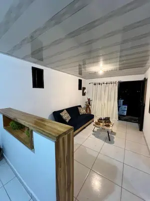 a living room with a blue couch in a room at Villa Guarne Merlot in Guarne