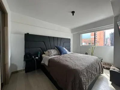 a bedroom with a large bed and a large window at apartamento familiar de 3 habitaciones por meses in La Estrella