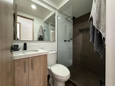 a bathroom with a toilet and a sink and a shower at apartamento familiar de 3 habitaciones por meses in La Estrella