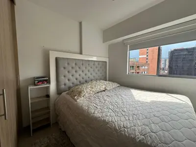 a bedroom with a large bed and a window at apartamento familiar de 3 habitaciones por meses in La Estrella