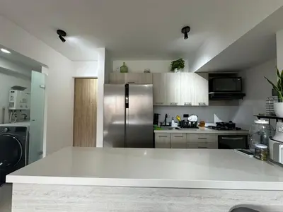 a kitchen with a stainless steel refrigerator at apartamento familiar de 3 habitaciones por meses in La Estrella