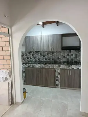 an archway in a kitchen with a stone wall at Tu Lugar ideal in Envigado
