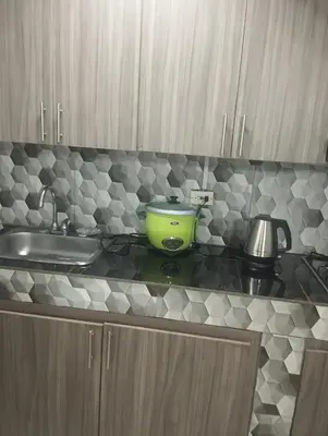 a kitchen counter top with a green pot on it at Tu Lugar ideal in Envigado