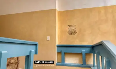 a building with a staircase with a sign on the wall at Autenthico Provenza Home Medellin in Medellín