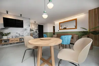 a dining room with a table and chairs at Poblado Apt with King bed and Free parking 216 in Medellín