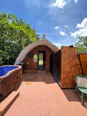 an outside view of a building with a doorway at consorcio club Paradise in San Rafael
