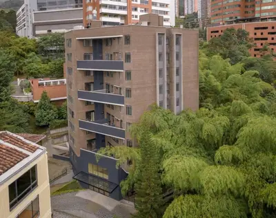 an apartment building with trees in front of it at DUP 315 Tesoro - Cls in Medellín