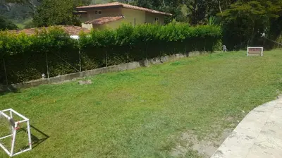 a yard with a soccer ball in the grass at Casa de Pacho in Bello