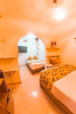 a room with two beds and a tv in it at Índigo Cowork in San Rafael