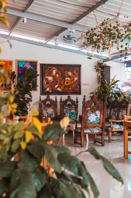 a room with chairs and paintings on the wall at Índigo Cowork in San Rafael