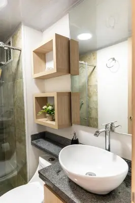 a bathroom with a white sink and a shower at Apartamento via TERMALES Y LOS NEVADOS in Manizales