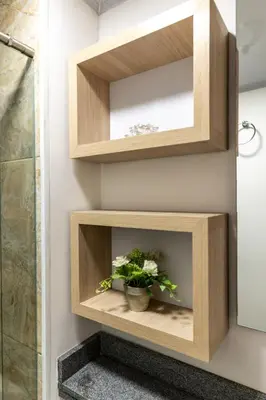 a bathroom with wooden shelves and a plant at Apartamento via TERMALES Y LOS NEVADOS in Manizales