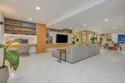 a living room with a couch and a table at Opulent and Luxury 4 Bedroom in Sabaneta