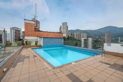 a swimming pool on the roof of a building at Opulent and Luxury 4 Bedroom in Sabaneta