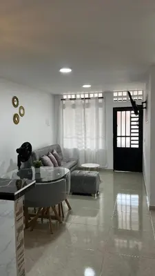 a living room with a couch and a table at Casa del Sol in Mariquita