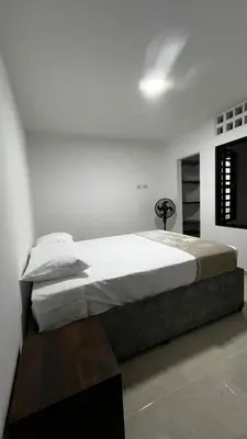 a bedroom with a large bed in a room at Casa del Sol in Mariquita