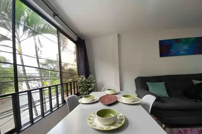 a living room with a table and a couch at Apartamento 2 habitaciones Viva Envigado in Envigado