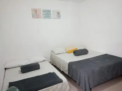 two beds sitting next to each other in a room at Excelente Ubicación en La 70-Laureles in Medellín