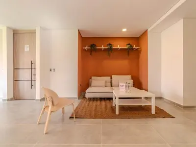 a living room with a bed and a table at The Living House by Wynwood House in Medellín