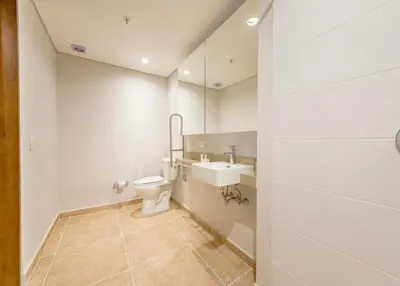 a bathroom with a toilet and a sink at Contemporary Space Steps from El Tesoro 305 in Medellín