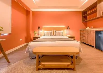 a bedroom with a large bed and a tv at Comfort and Style -Exclusive Area in El Tesoro 307 in Medellín