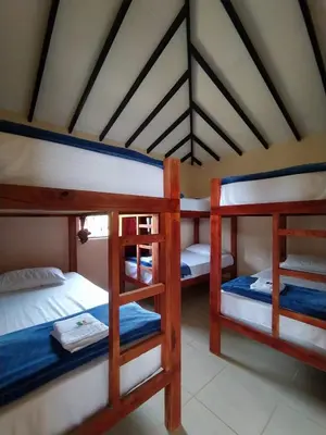 a bedroom with three bunk beds in a room at Centro vacacional campo verde in Cocorná