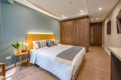 a bedroom with a large bed in a room at Vibrant Space- Explore Wonders in El Tesoro 313 in Medellín