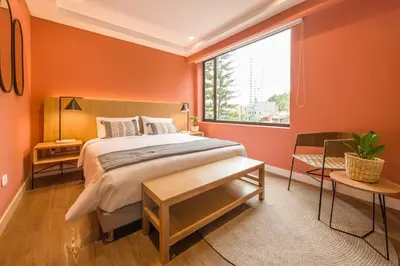 a bedroom with a large bed and a large window at Elegant Space in El Tesoro Recharge in Comfort 308 in Medellín