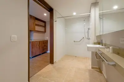a bathroom with a sink and a shower and a mirror at Elegant Space in El Tesoro Recharge in Comfort 308 in Medellín
