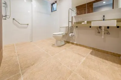 a bathroom with a toilet and a sink at El Tesoro Stylish Escape - Urban Vibes 312 in Medellín