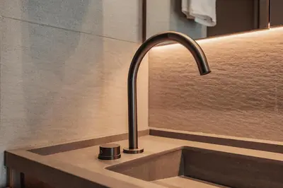 a kitchen sink with a faucet on a counter at The Somos Loho Hotel in Medellín