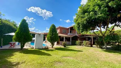 a house with a yard with trees and a pool at Espectacular finca , San Jerónimo in San Jerónimo