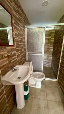 a bathroom with a sink and a toilet at Espectacular finca , San Jerónimo in San Jerónimo